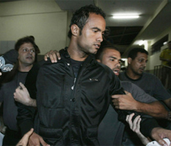 Top Brazilian footballer accused of killing girlfriend, feeding her to dogs