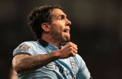Tevez sinks Wigan as City close gap on United