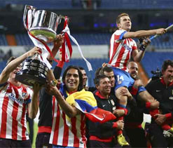 Atletico celebrate Spanish Cup win after 14 years