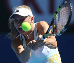 Shining Wozniacki puts Azarenka in shade