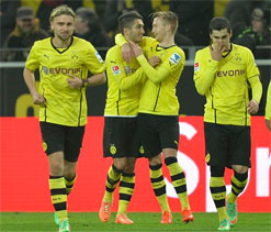 Dortmund tighten hold on second spot with win at Freiburg